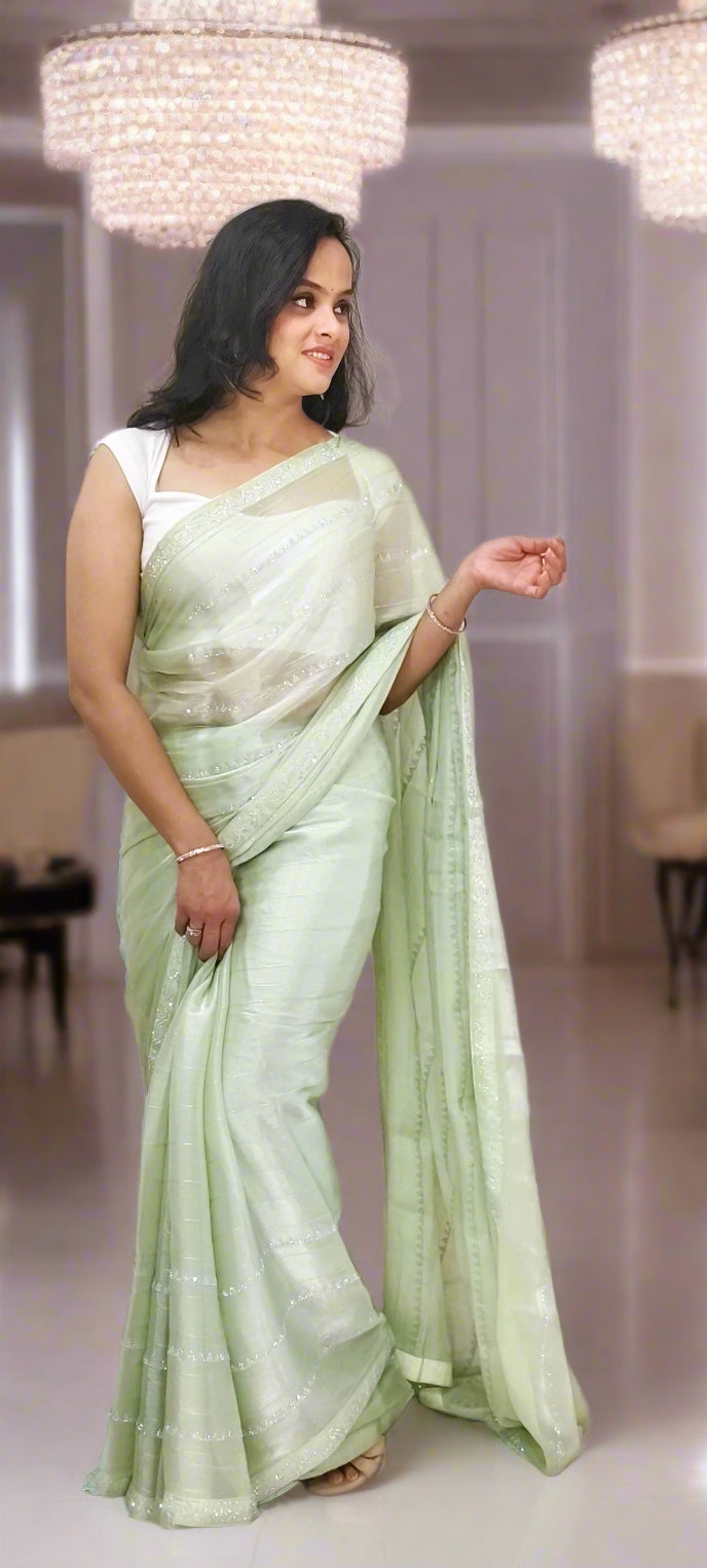 Elegant Pastel Green Jimmy Choo Saree with Subtle Shimmer
