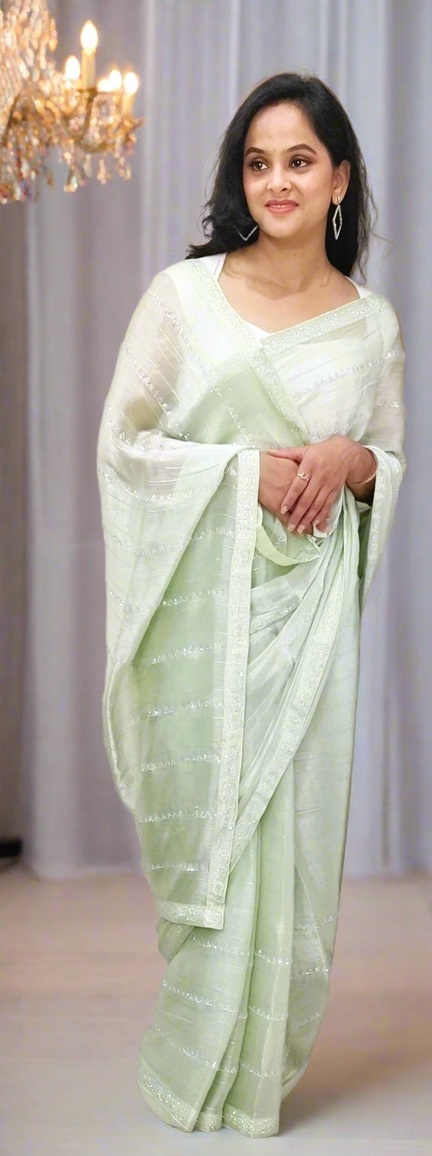Elegant Pastel Green Jimmy Choo Saree with Subtle Shimmer