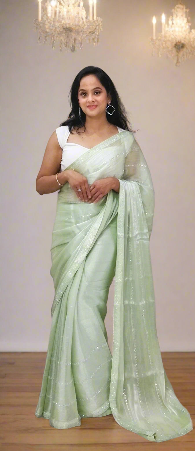 Elegant Pastel Green Jimmy Choo Saree with Subtle Shimmer
